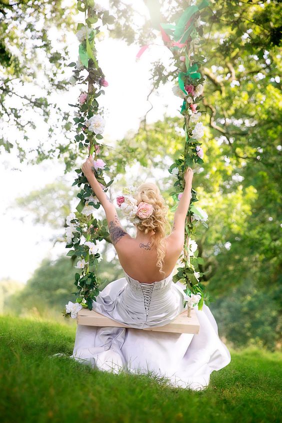heavenly beautiful swing with pink and blush flowers and leaves