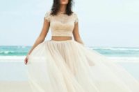 21 ivory flowy tulle skirt and a lace cap sleeve crop top with pearls