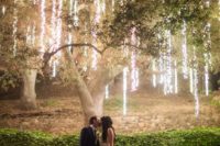 21 vertical lights hanging from the tree create a magic ambience