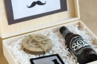 22 a wooden box with a beer bottle and coasters as a gift