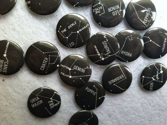 black badges with white constellation decor as favors