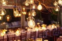 22 candle lanterns and large bulbs hanging from the branches create a mood