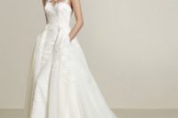 23 illusion strapless neckline wedding dress with lace appliques, a detachable overskirt with pockets
