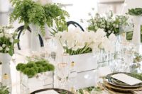 23 lots of greenery, moss and white blooms on a mirror table