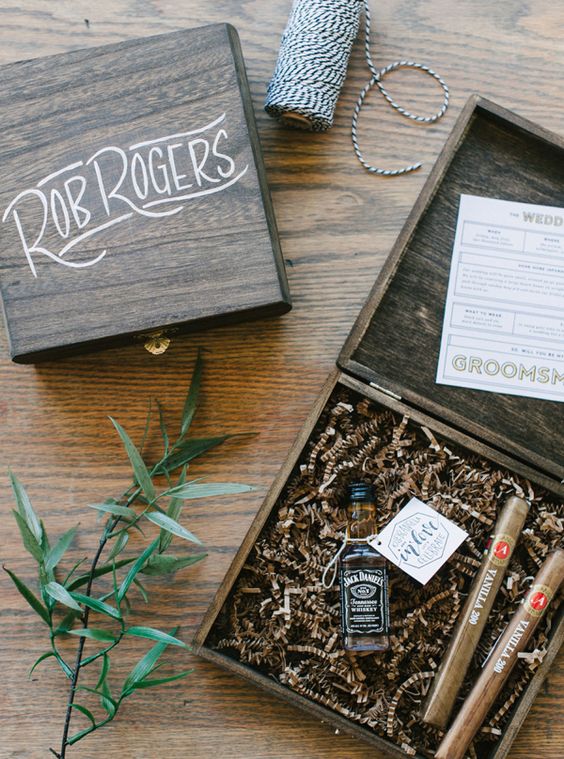 rustic wooden boxes with a small alcohol bottle and cigars is a classic option
