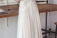 24 modern romantic wedding dress with a V neck, a pleated skirt and a lace bodice