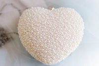 25 heart-shaped pearl bridal clutch is the cutest idea ever