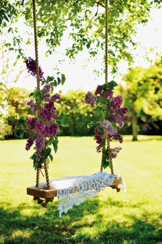 lilac branches tied to a garden swing and a dily will make it sweet