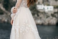 27 ivory wedidng dress with an illusion bodice, no back, sheer sleeves and floral appliques