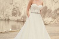 27 ruched strapless wedding dress with an embellished belt and pockets
