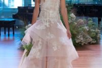 27 strapless blush high low wedding dress with a ruffled skirt and white lace appliques