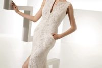 28 textural lace fitting wedding dress with a plunging neckline, a front slit and pockets