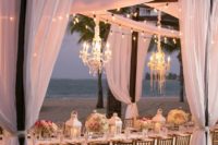 29 bulbs and glam chandeliers for a romantic beachside reception