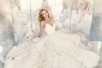 29 spaghetti strap V neckline ballgown with pastel-colored floral appliques on the skirt