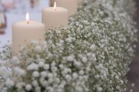 30 lining up the table with pillar candles is a gorgeous idea