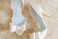 30 white peep toe heels with bows accentuated with pearls