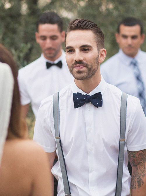 a cotton white shirt with short sleeves, a navy bow tie and suspenders to go
