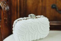31 gorgeous pearl curve wedding clutch with an oversized rhinestone