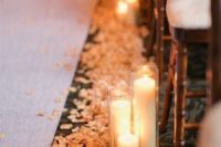 31 line up the wedding aisle with candles and colorful petals