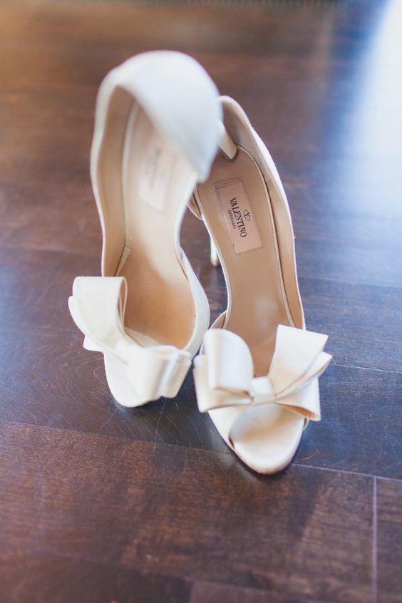 white Valentino heels with peep toe on bows on the toecaps