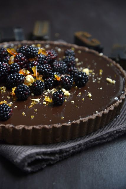 dark chocolate tart with blackberries and hazelnut pralines