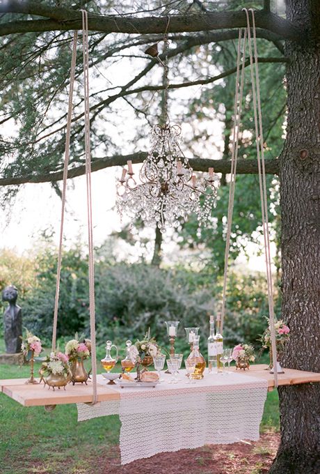 a swing turned into a hanging bar for an outdoor wedding