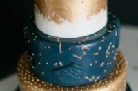 34 navy, copper and white wedding cake with constellation detailing
