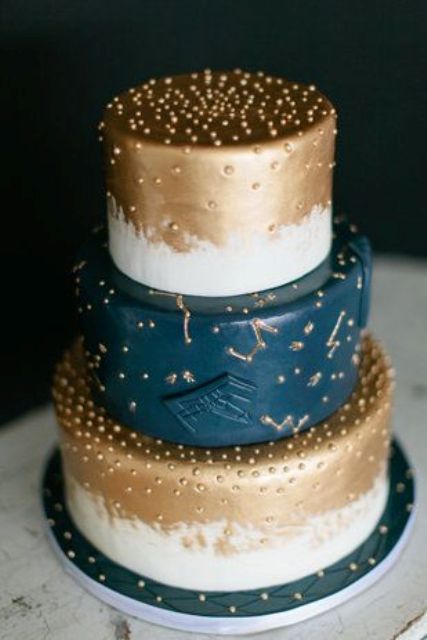 navy, copper and white wedding cake with constellation detailing