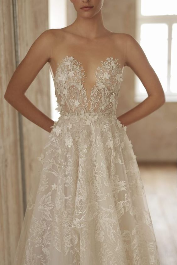 a delicate illusion strapless wedding dress with lace and floral applique is a gorgeous idea for a refined and subtle bridal look
