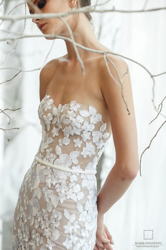 a strapless mermaid wedding dress completely covered with floral appliques is amazing for spring