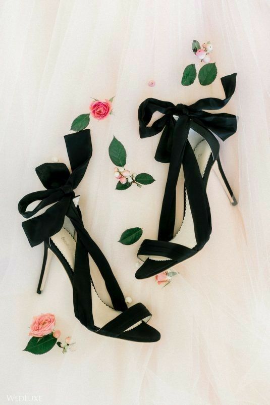 black wedding shoes with large bows and high heels are amazing for any bridal look, and they will create an accent