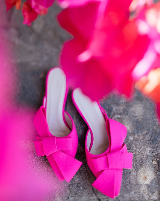 bold fuchsia wedding mules with oversized bows are a bold statement in your bridal look