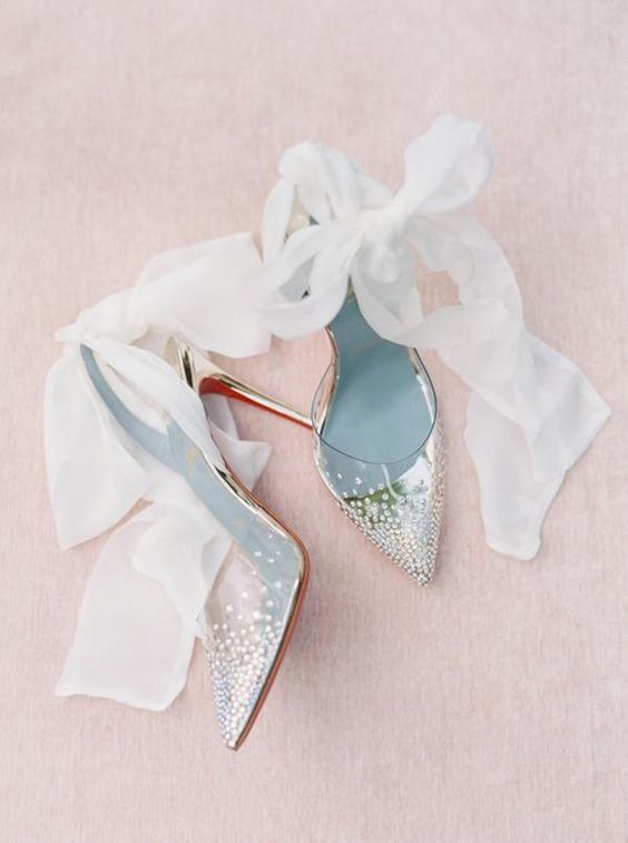 clear wedding shoes with rhinestones, large ribbon bows are adorable for a glam and chic bridal look