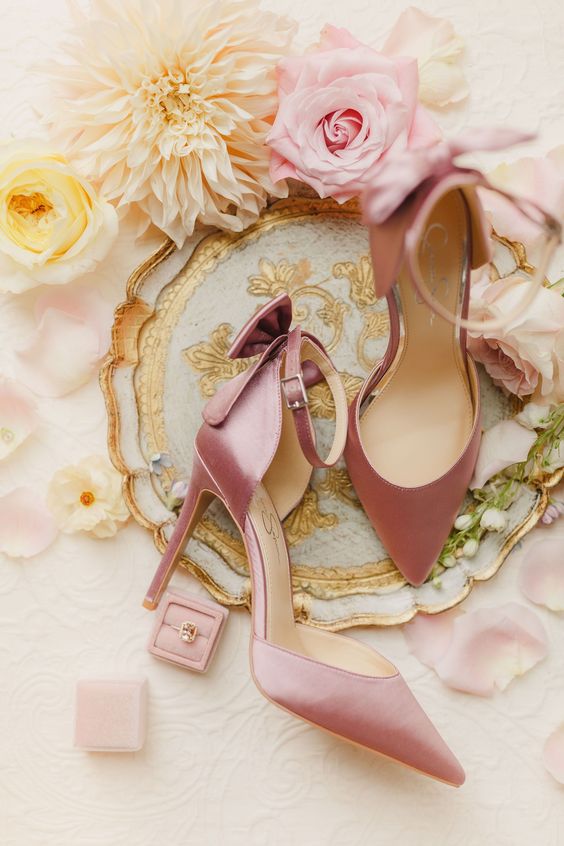 dusty pink wedding shoes with bows on the backs and high heels are amazing for a delicate touch of color