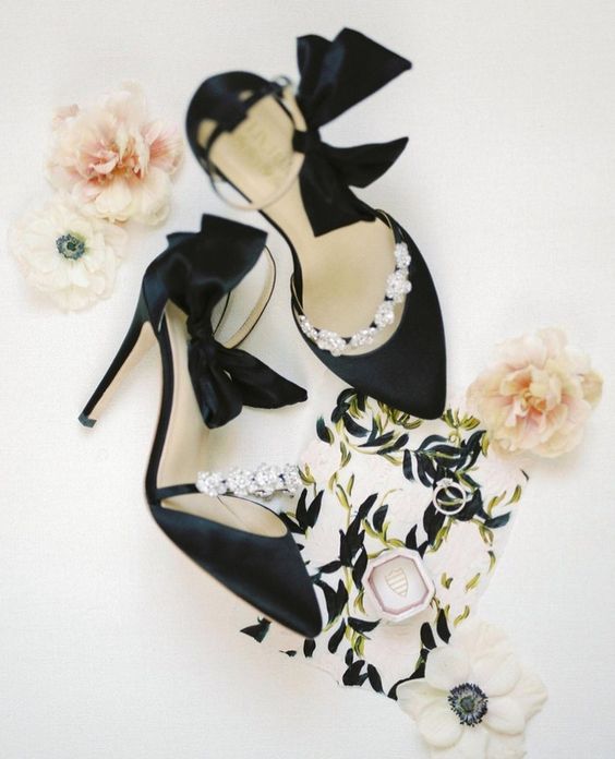 glam black wedding shoes with embellished straps and black bows on the ankles are amazing for a lovely and chic look