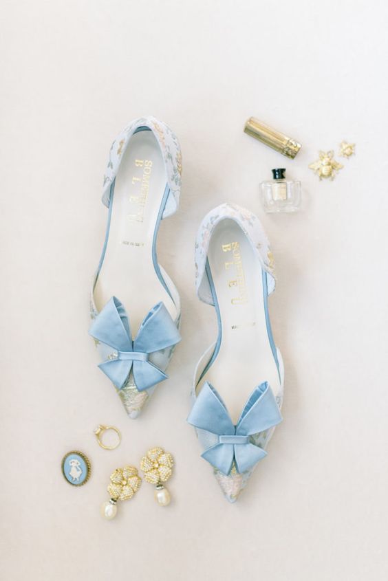 glam blue printed shoes with large blue bows on the tops are amazing for a spring or summer wedding