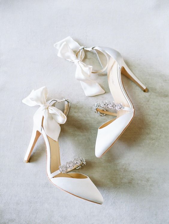 white wedding shoes with embellished straps and bows on the ankle straps are amazing for spring and summer outfits