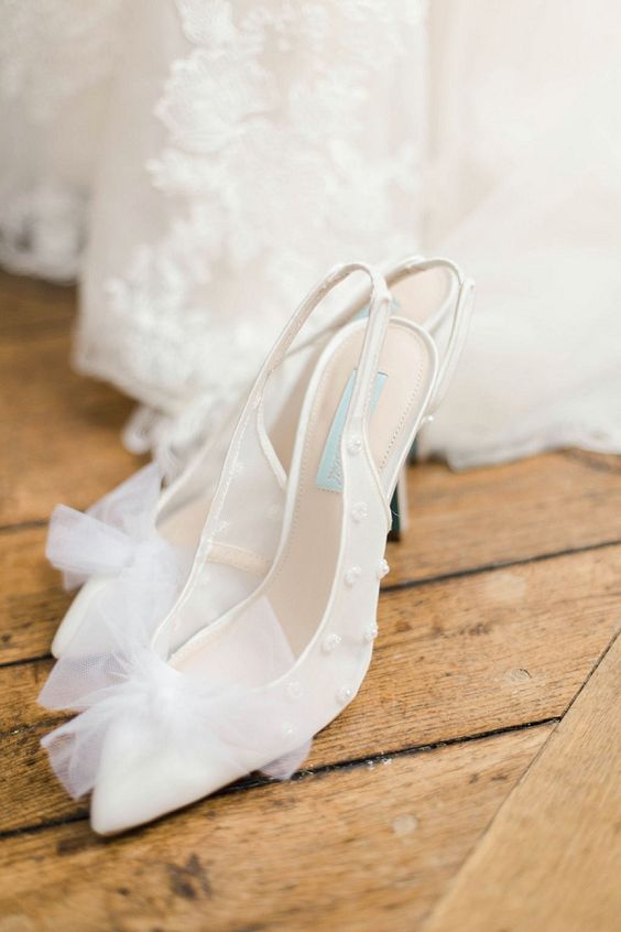 white wedding slingbacks with beads and tulle bows on tops are amazing for spring and summer weddings