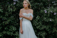 03 The bride was wearing an off the shoulder wedding dress with a detailed bodice