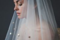 04 a veil with metallic star decor and a sparkling wedding dress