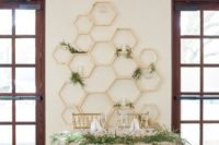 04 gold hexagon sweetheart table backdrop with fresh greenery