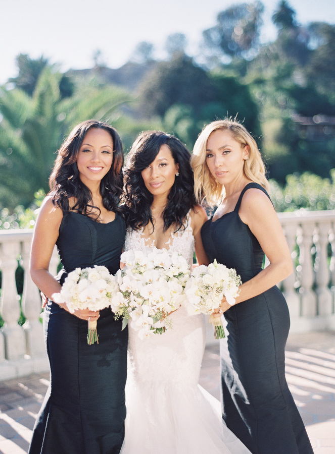 The bridesmaids were wearing elegant fit and flare black dresses