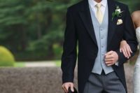 05 morning wedding suit with a grey wasitcoat and a light yellow tie and buttonhole