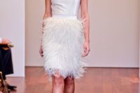 a short sleeveless wedding dress with a plain bodice and a feather skirt and white ankle strap shoes are a great combo for a modern glam wedding