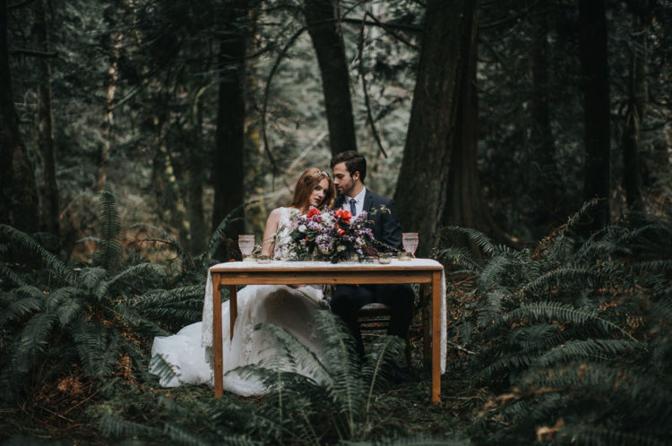 Such magical photos like this one, with the couple sitting in the woods, are stunning