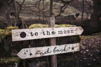 07 A rustic wedding sign with the moon, sun and stars motifs