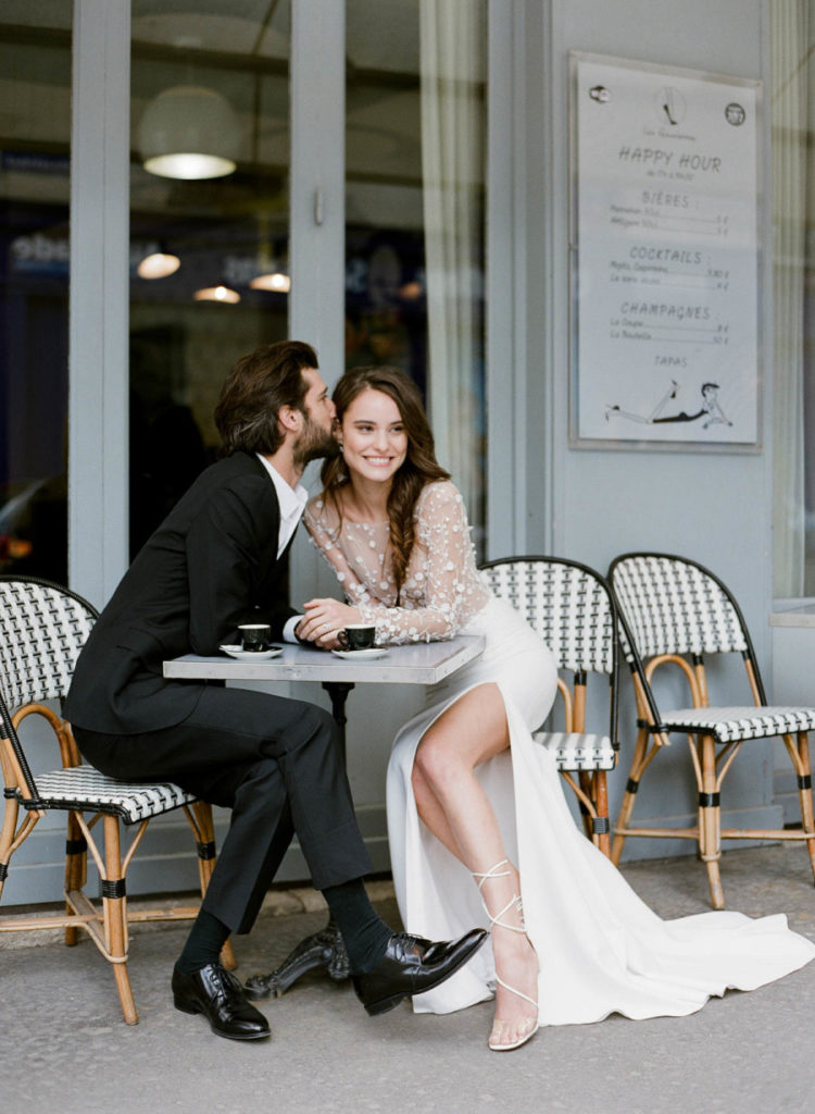 The second wedding dress was with a lace applique long sleeve bodice and a plain skirt with a side slit