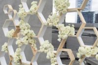 07 honeycomb wedding backdrop topped with fresh white roses