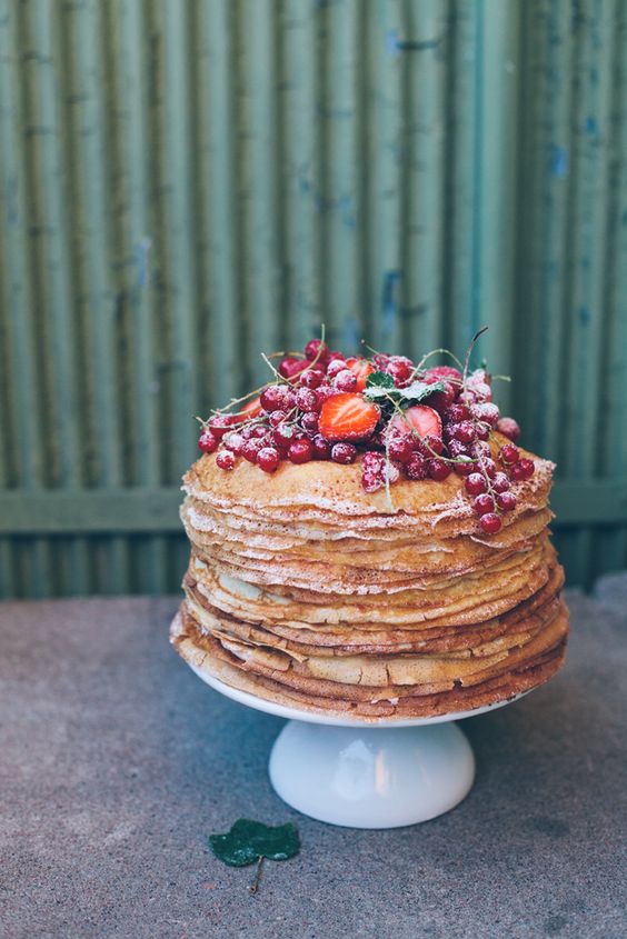 pancake wedding cake with fresh berries and sugar powder