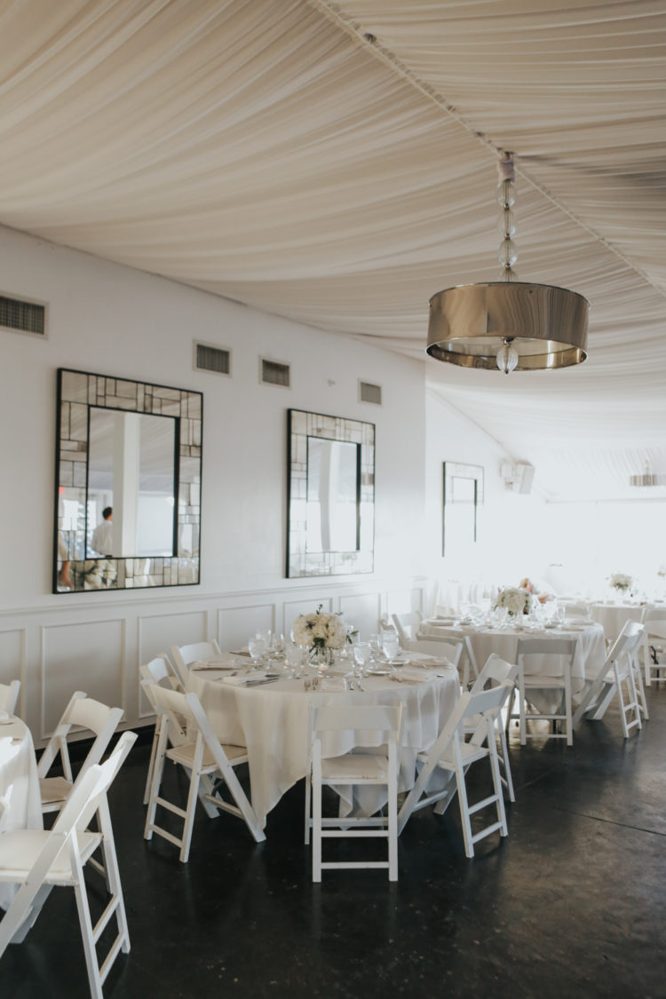 The reception was also decorated in all-white, with mirroring and metallic touches for a chic look